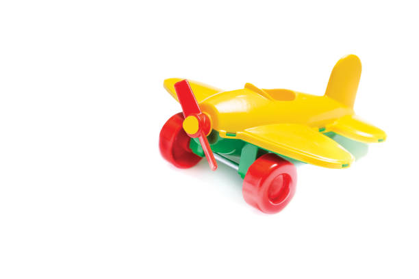 istock toy yellow plane with a screw closeup isolate on a white background. Macro 1174109347