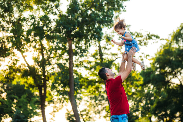 istock Father makes his daughter to fly 1174110809