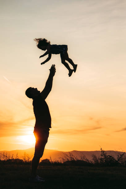 istock Father makes his daughter to fly 1174110830