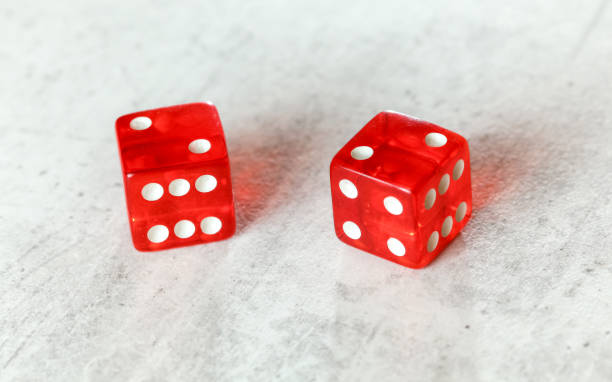 istock Two translucent red craps dices on white board showing Hard Four / Little Joe (double number two) 1174111426