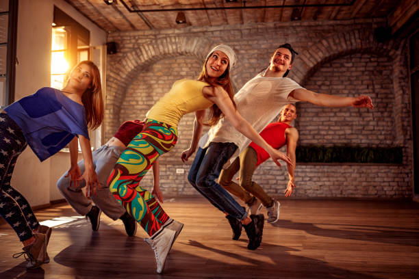 Passion dance team - urban hip hop dancer exercising dance training in studio Passion dance team - Group of urban hip hop dancer exercising dance training in studio zumba image stock pictures, royalty-free photos & images