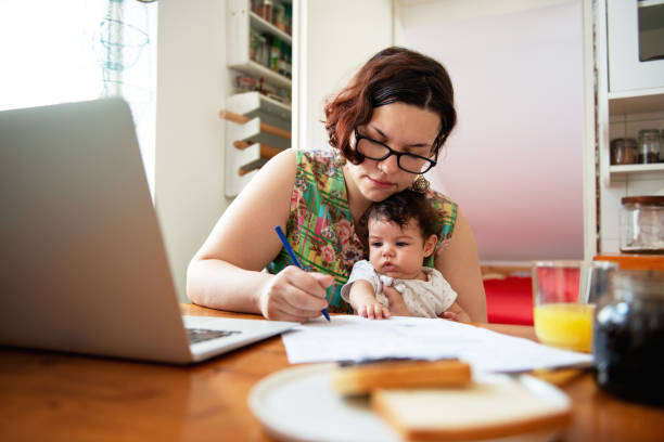 istock Young mother working from home 1174112714