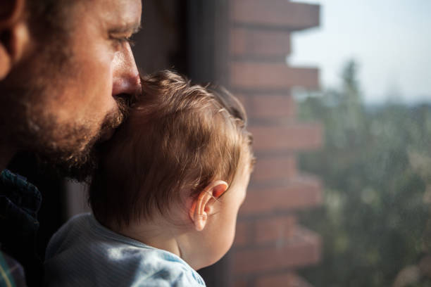 istock Father kissing his baby son 1174114992