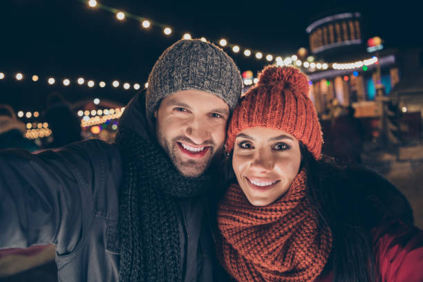 istock Self-portrait of his he her she nice attractive charming cute lovely cheerful cheery glad couple wearing warm outfit spending December newyear winter vacation strolling festal mood atmosphere outdoor 1174116607