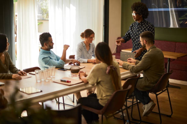 istock Business meeting, creative worker sharing his latest ideas. 1174118117