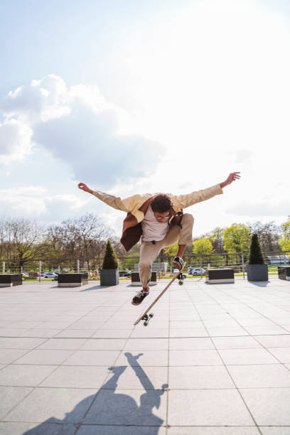 istock Skateboarder jumped into air and sees his shadow 1174118340
