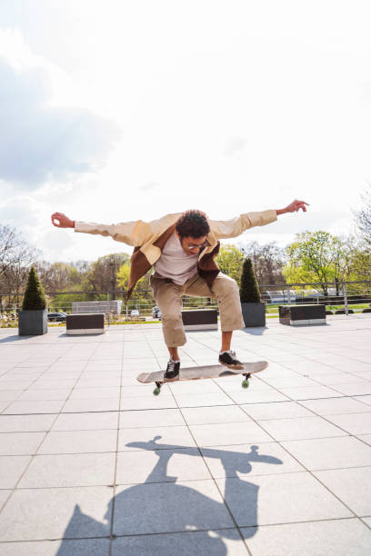 istock Skateboarder jumped into air and sees his shadow 1174118978