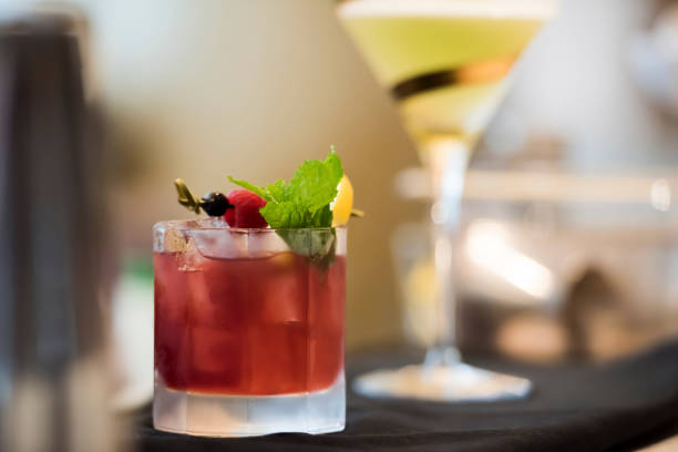 istock Waiter serving cocktails to customer 1174124072