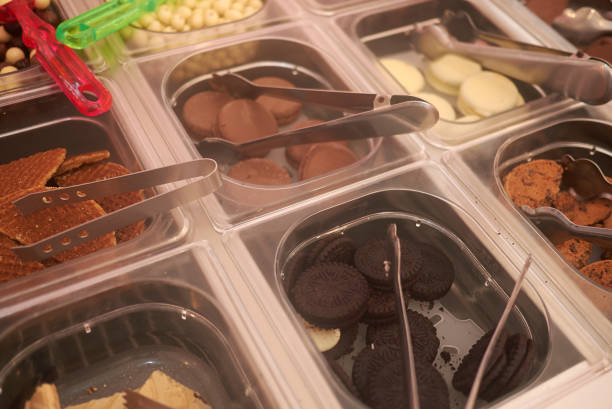istock Ibiza, Spain - September 01, 2019 : Biscuits and sweets as a topping for frozen yogurt 1174125790