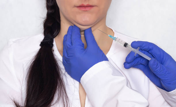 Doctor gives lipolytic injection to a caucasian girl's double chin on a white background, medical, close-up Doctor gives lipolytic injection to a girl's double chin on a white background, medical, close-up fat ugly face stock pictures, royalty-free photos & images