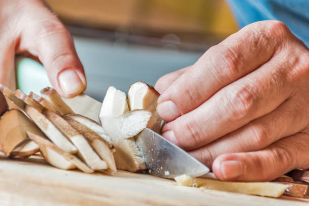 Close Up Man Hands Preparing Porcini Mushrooms for Meal