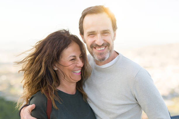 istock Romantic couple smiling and cuddling on a sunny day 1174138414