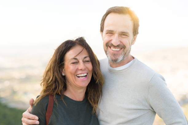 istock Romantic couple smiling and cuddling on a sunny day 1174138453