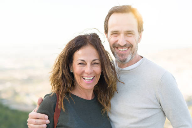istock Romantic couple smiling and cuddling on a sunny day 1174138464
