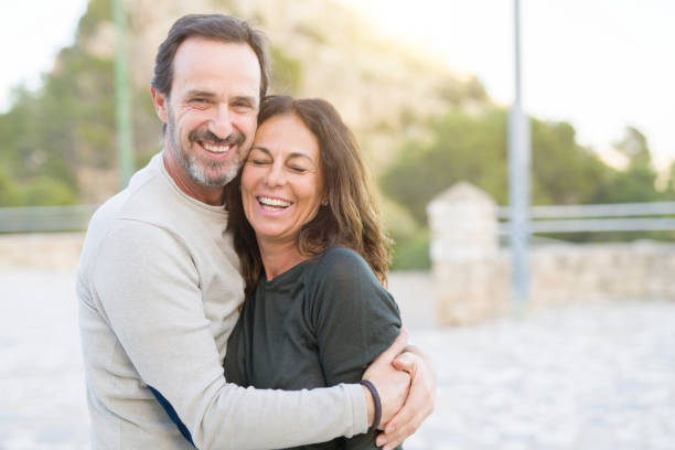 istock Romantic couple smiling and cuddling on a sunny day 1174138592