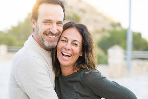 istock Romantic couple smiling and cuddling on a sunny day 1174138605