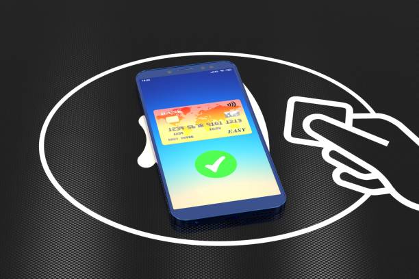 3d illustration: The technology of wireless payment of purchases. Orange credit card on mobile phone screen with a green checkmark confirming the transfer. The device lies on an acceptance module. ilustración 3d: la tecnología de pago inalámbrico de compras. tarjeta de crédito naranja en la pantalla del teléfono móvil con una marca de verificación verde que confirma la transferencia. el dispositivo se encuentra en un módulo de aceptación.