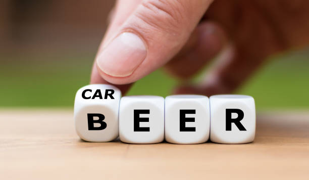 istock Stop drinking alcohol concept. Hand turns a dice and changes the word 