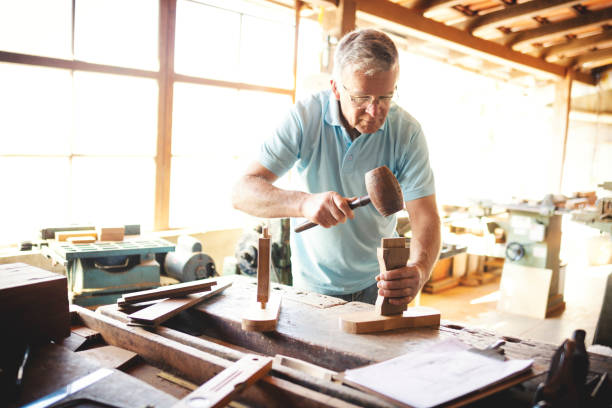 istock Senior man working in a carpentry. 1174141887