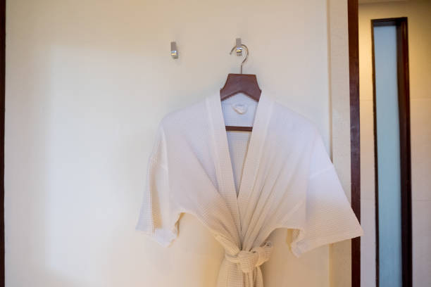 istock White bathrobe on a hanger prepared to use 1174143417