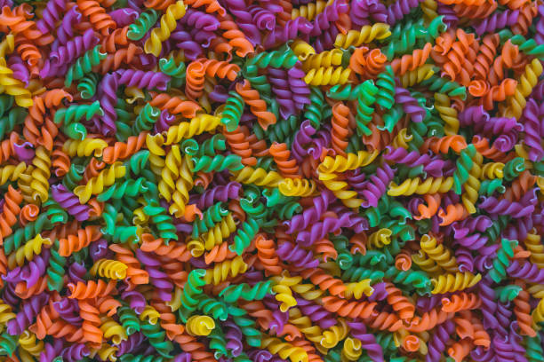 Colorful pasta, background. Copy space. Vegetarian meal. Tasty italian pasta food. Table top view. Tasty meal.