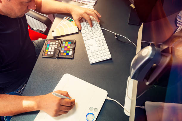 istock Professional computer graphic designer calibrates the computer monitor 1174145535