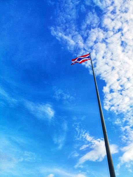 istock Thai Flag on top pole and cloudy sky background 1174145927