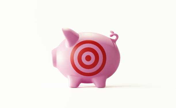 piggy bank with bulls eye target standing on white background - target aspirations bulls eye dart imagens e fotografias de stock