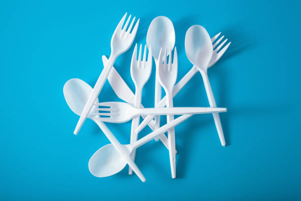 istock single use plastic forks, spoons. concept of recycling plastic, plastic waste 1174146453
