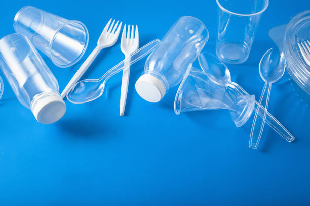 istock single use plastic bottles, cups, forks, spoons. concept of recycling plastic, plastic waste 1174147615