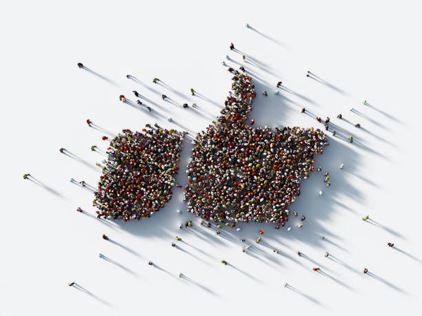 human crowd forming a big thumbs up icon: social media concept - social media teamwork global communications togetherness imagens e fotografias de stock