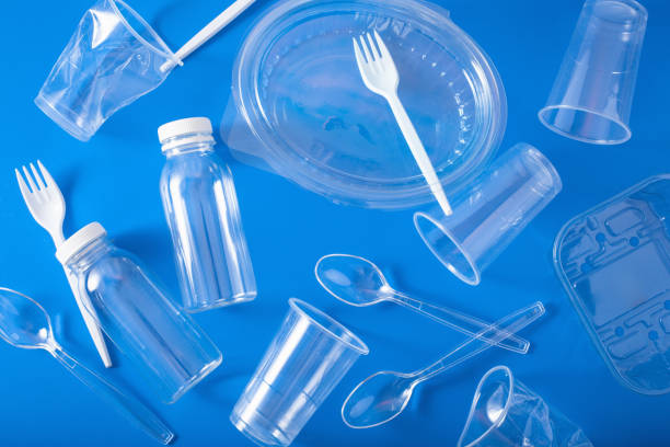 istock single use plastic bottles, cups, forks, spoons. concept of recycling plastic, plastic waste 1174149340