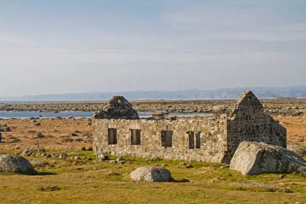 Lone decayed sheepfold on the North Sea coast at Lista in Norway