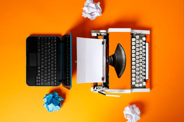istock Digital and analog – Laptop and 70s Typewriter 1174149554
