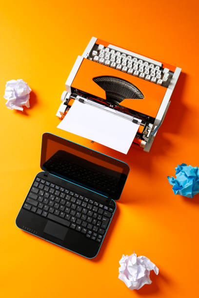 istock Digital and analog – Laptop and 70s Typewriter 1174149773