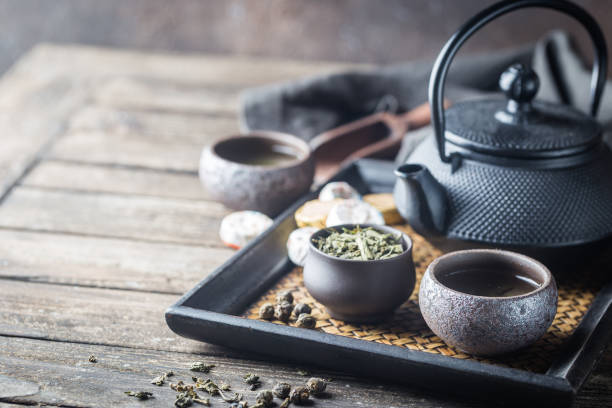 tè verde sano - tea leaves chinese tea green tea tea foto e immagini stock