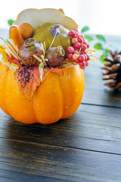 istock Halloween pumpkin head jack lantern on wooden background 1174154519