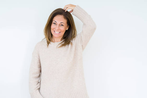 istock Beautiful middle age woman over isolated background confuse and wonder about question. Uncertain with doubt, thinking with hand on head. Pensive concept. 1174155696