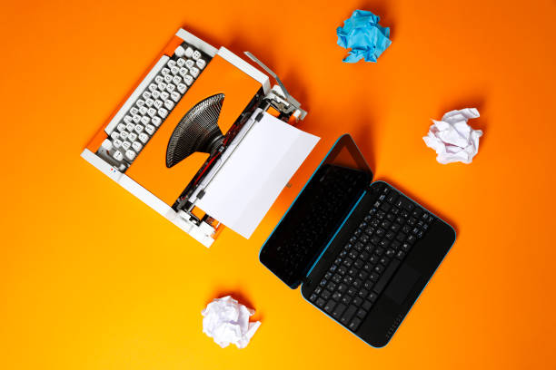 istock Digital and analog – Laptop and 70s Typewriter 1174155892