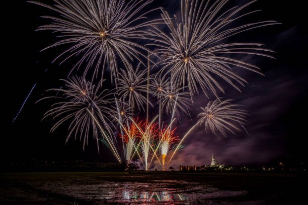 istock Huge, colorful fireworks over the rice fields at dusk. 1174159952