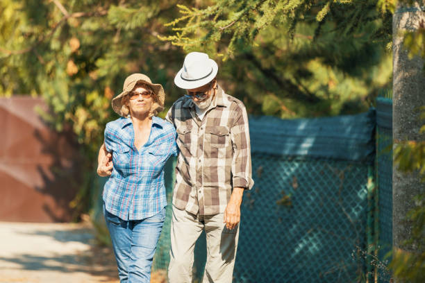 istock Active seniors on a walk in autumn forest 1174163736
