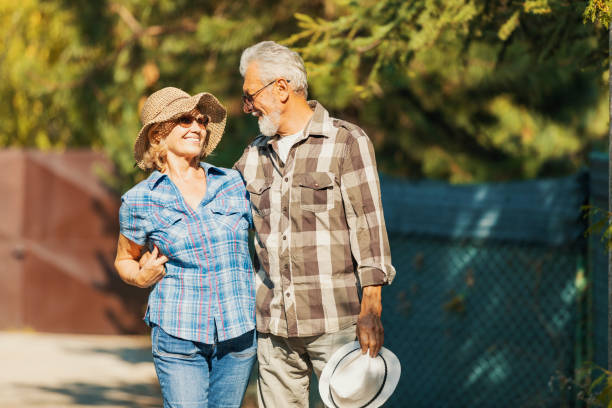 istock Active seniors on a walk in autumn forest 1174164587