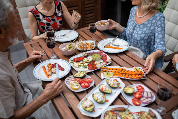 istock Seniors Having Vegan BBQ Party 1174165038