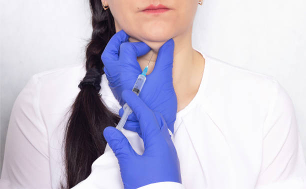 Doctor gives double-chin patient an injection of lipolytic drugs, medicine, close-up, problems Doctor gives double-chin patient an injection of lipolytic drugs, medicine, close-up fat ugly face stock pictures, royalty-free photos & images