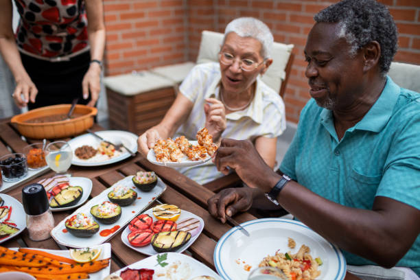 Happy Seniors Having Vegan BBQ Party