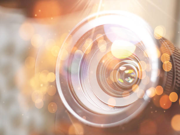 istock lens digital camera, selective focus, close-up, side with reflection, bokeh, isolated on white background 1174165746