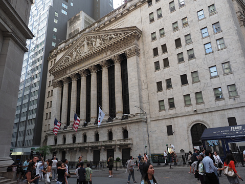 New York, USA - May 31, 2019: Image of the many tourists near the New York Stock Exchange.