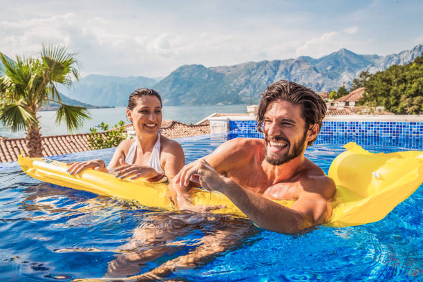 istock young couple have fun in a pool 1174170166