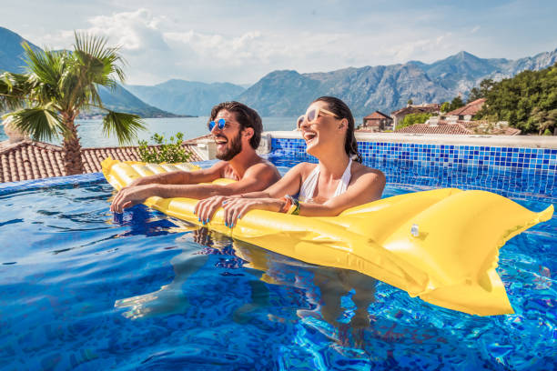 istock young couple have fun in a pool 1174170747