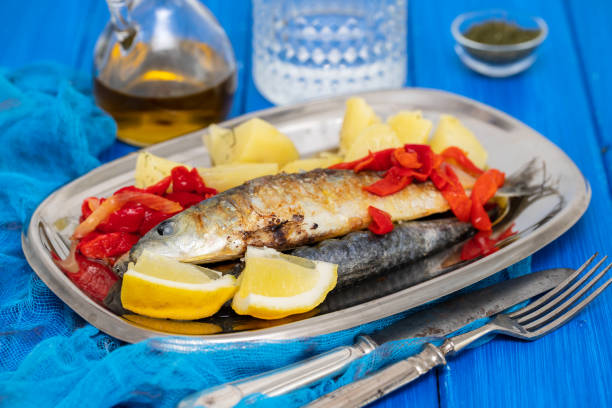 istock grilled sardines with pepper and boiled potato on dish 1174172174
